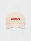 Non-Athlete ivory baseball cap with red embroidered logo