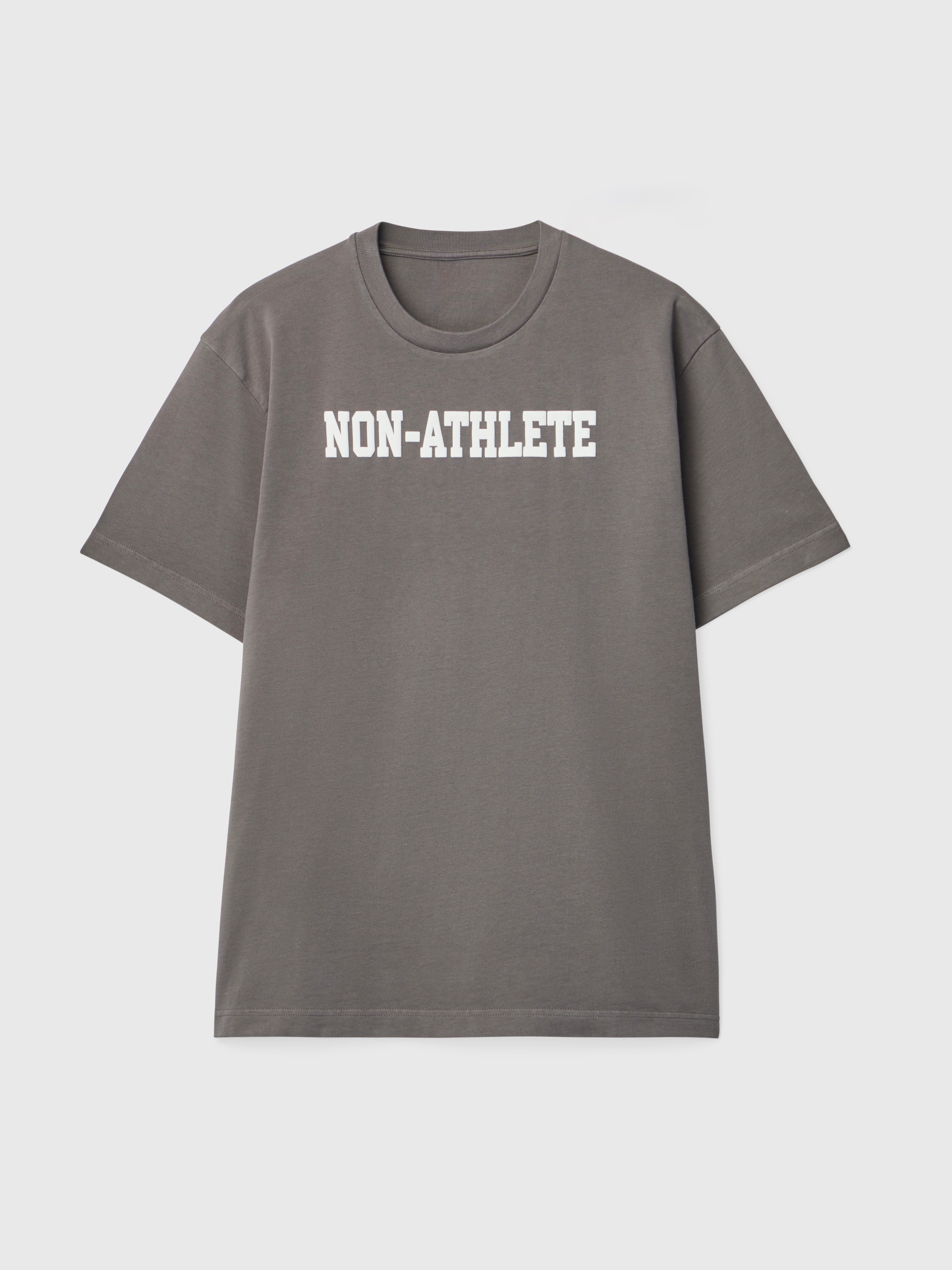 Model wearing the Non-Athlete Dark Grey Logo T-Shirt in heavyweight cotton